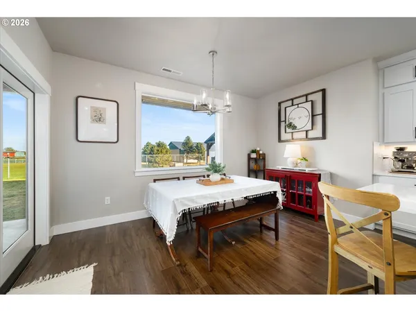 a living room with dining room and furniture