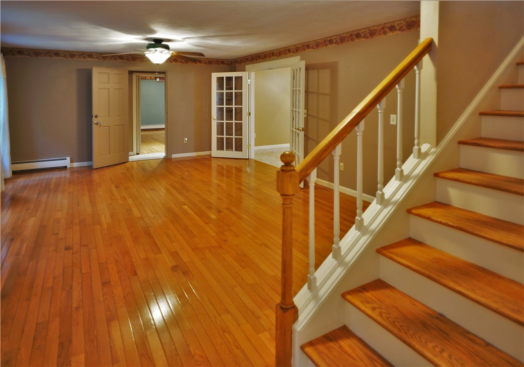 86 Log Road North Smithfield, RI 02830 - Photo 8 of 34 LIVING ROOM FACING INTERIOR APARTMENT ENTRANCE / DINING ROOM FRENCH DOORS