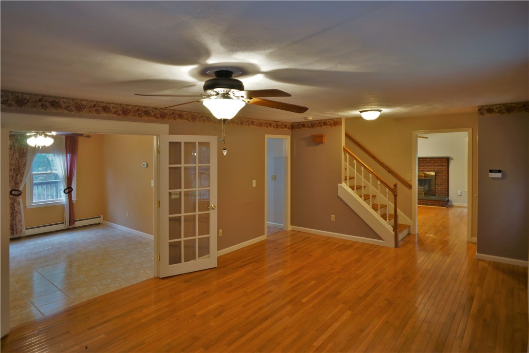 86 Log Road North Smithfield, RI 02830 - Photo 9 of 34 LIVING ROOM INTO DINING ROOM
