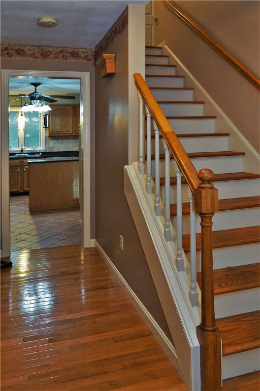 86 Log Road North Smithfield, RI 02830 - Photo 10 of 34 STAIRCASE FACING KITCHEN