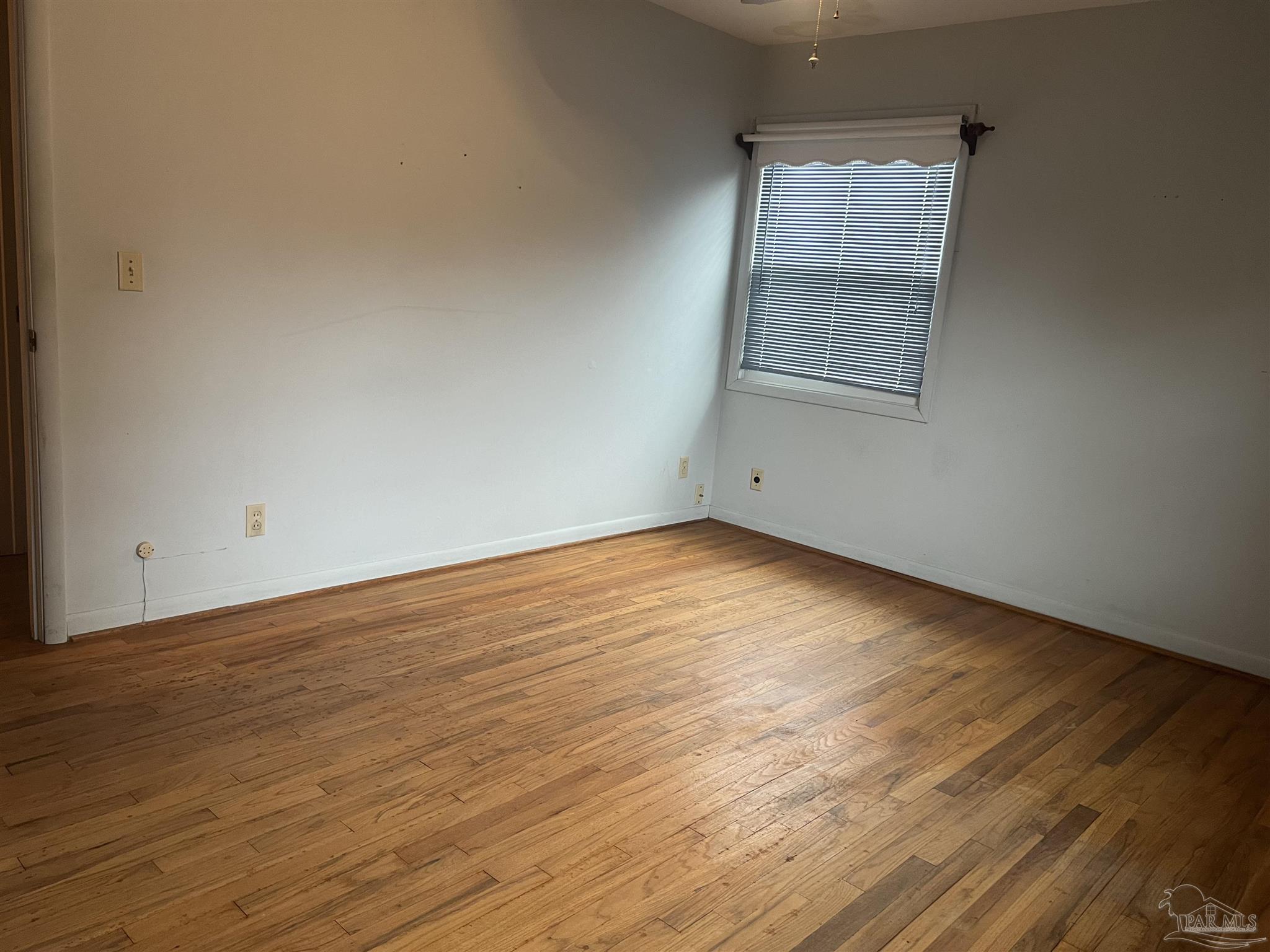 6020 Hilltop Road Pensacola, FL 32504 - Photo 15 of 27 wooden floor in an empty room