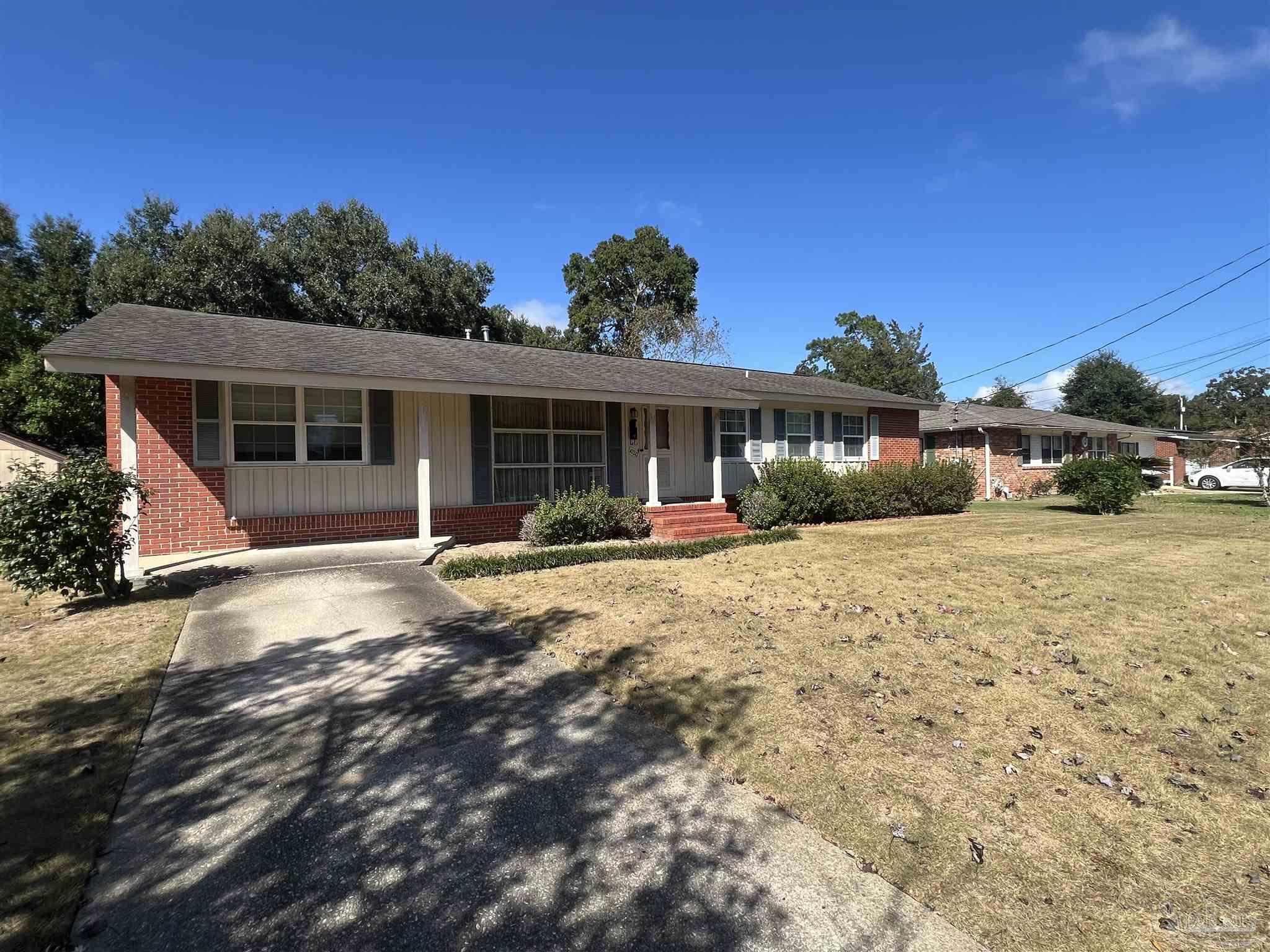 6020 Hilltop Road Pensacola, FL 32504 - Photo 27 of 27 a view of a house with a yard and potted plants