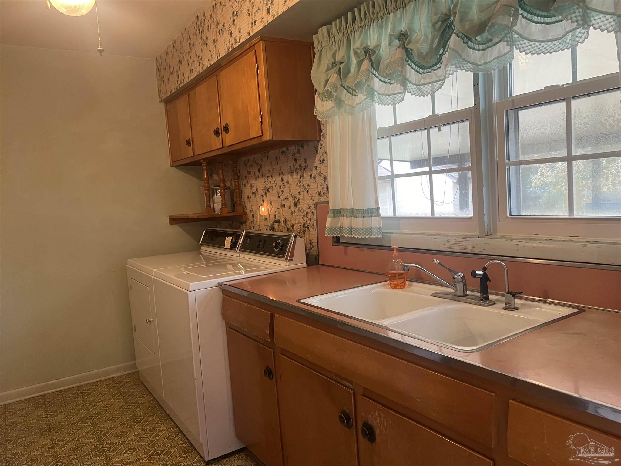 6020 Hilltop Road Pensacola, FL 32504 - Photo 6 of 27 a bathroom with a sink and a mirror