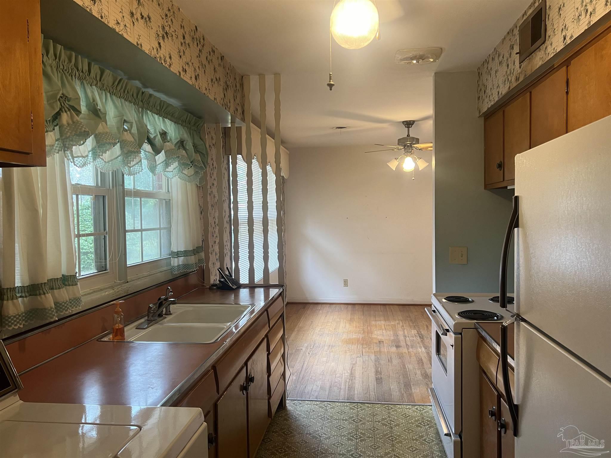 6020 Hilltop Road Pensacola, FL 32504 - Photo 7 of 27 a bathroom with a sink a mirror and a shower