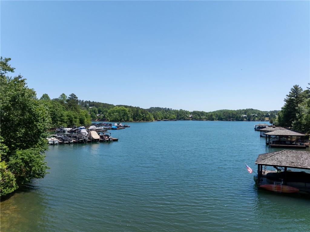 This serene lakefront property offers water views and convenient boat access for aquatic adventures.