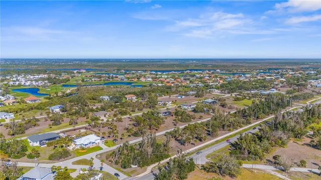 an aerial view of residential building and ocean