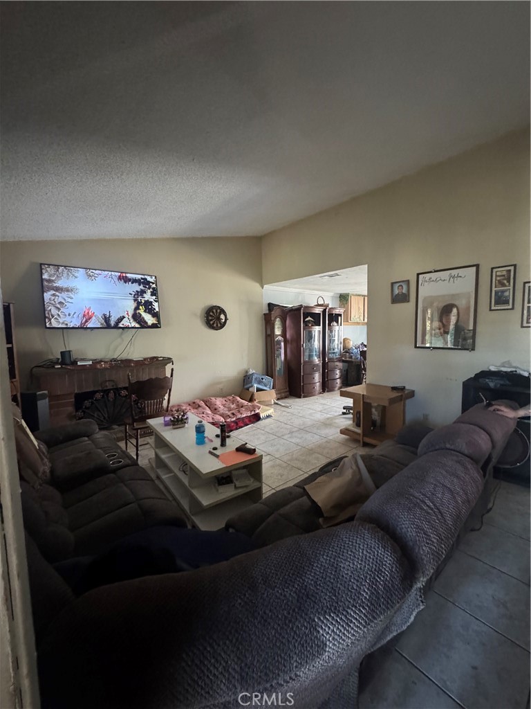 1266 Lorraine Place Rialto, CA 92376 - Photo 3 of 15 a living room with furniture and a couch
