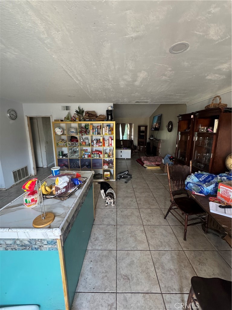 1266 Lorraine Place Rialto, CA 92376 - Photo 5 of 15 a kitchen with furniture and a stove