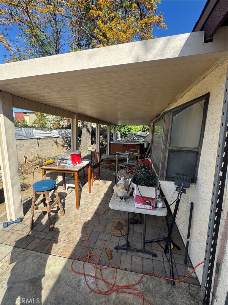 1266 Lorraine Place Rialto, CA 92376 - Photo 6 of 15 a patio with table and chairs