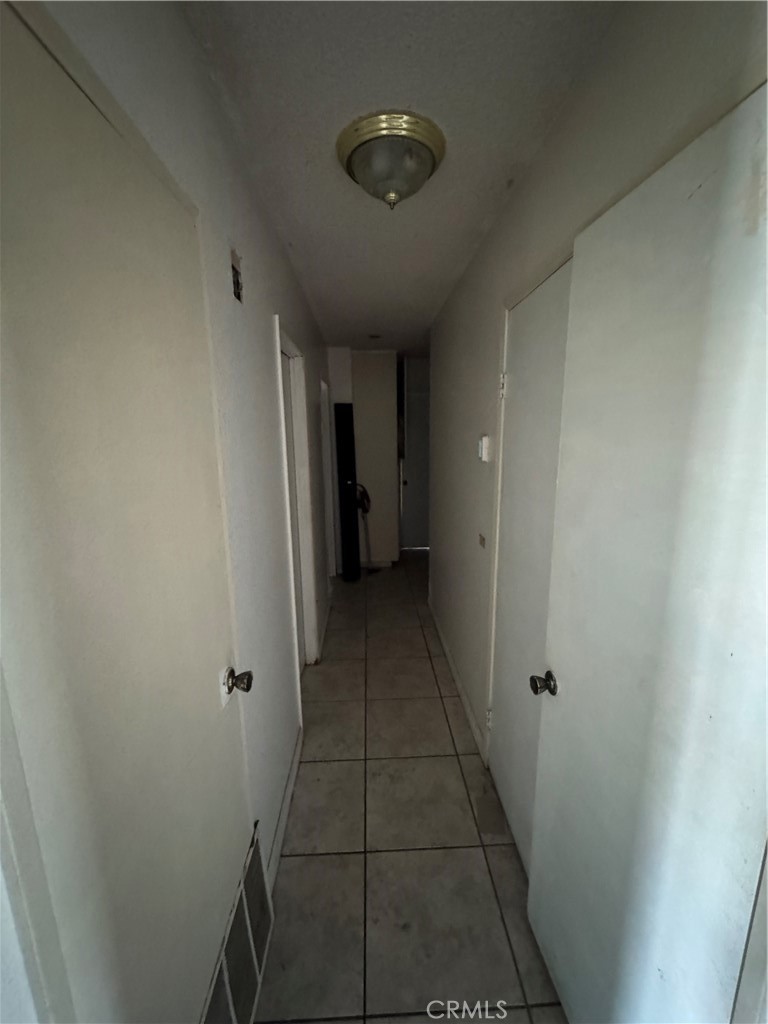 1266 Lorraine Place Rialto, CA 92376 - Photo 9 of 15 a view of a hallway