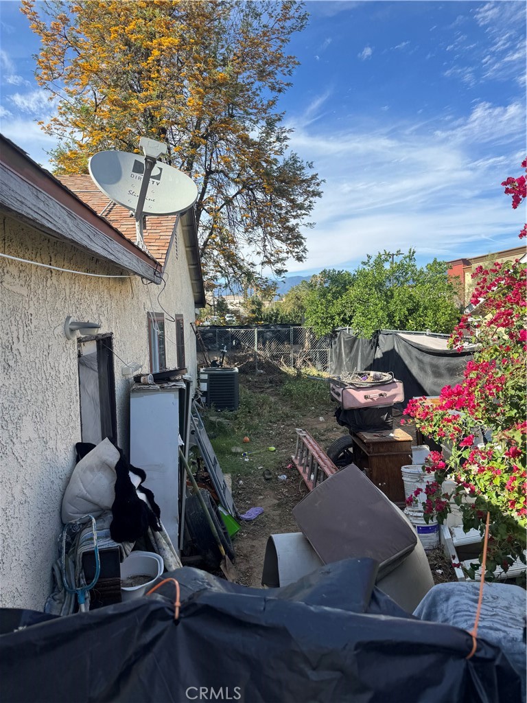 1266 Lorraine Place Rialto, CA 92376 - Photo 10 of 15 a view of backyard with seating space and trees in the background
