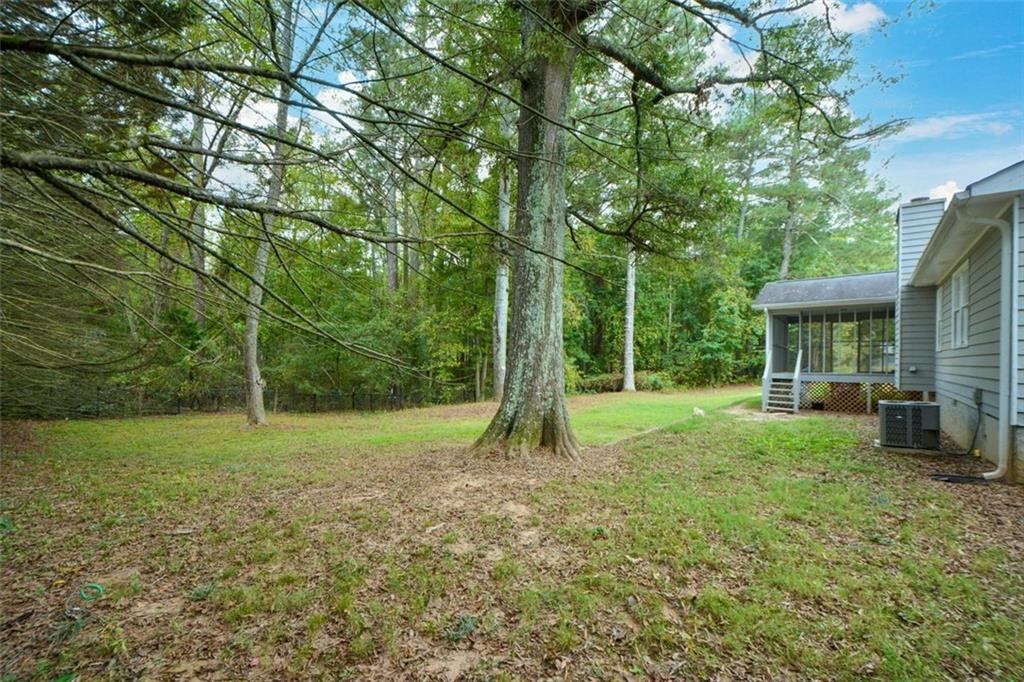 2895 Fairview Road Covington, GA 30016 - Photo 24 of 31 a view of a house with a backyard