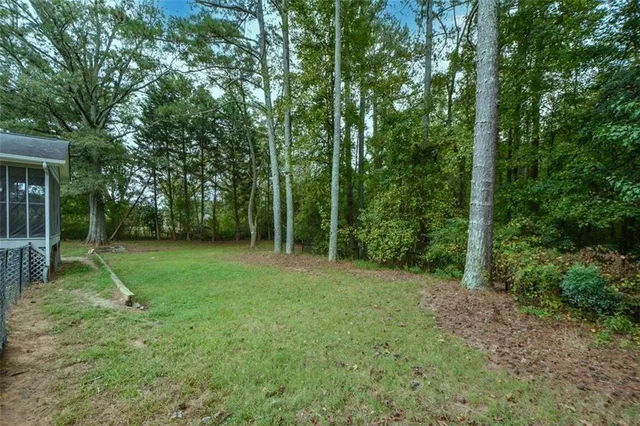 a view of a backyard with a trees