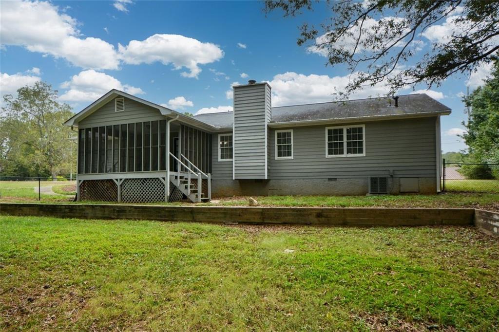 2895 Fairview Road Covington, GA 30016 - Photo 27 of 31 a view of a house with a yard