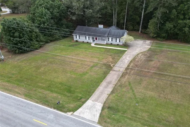 a view of a yard with a patio