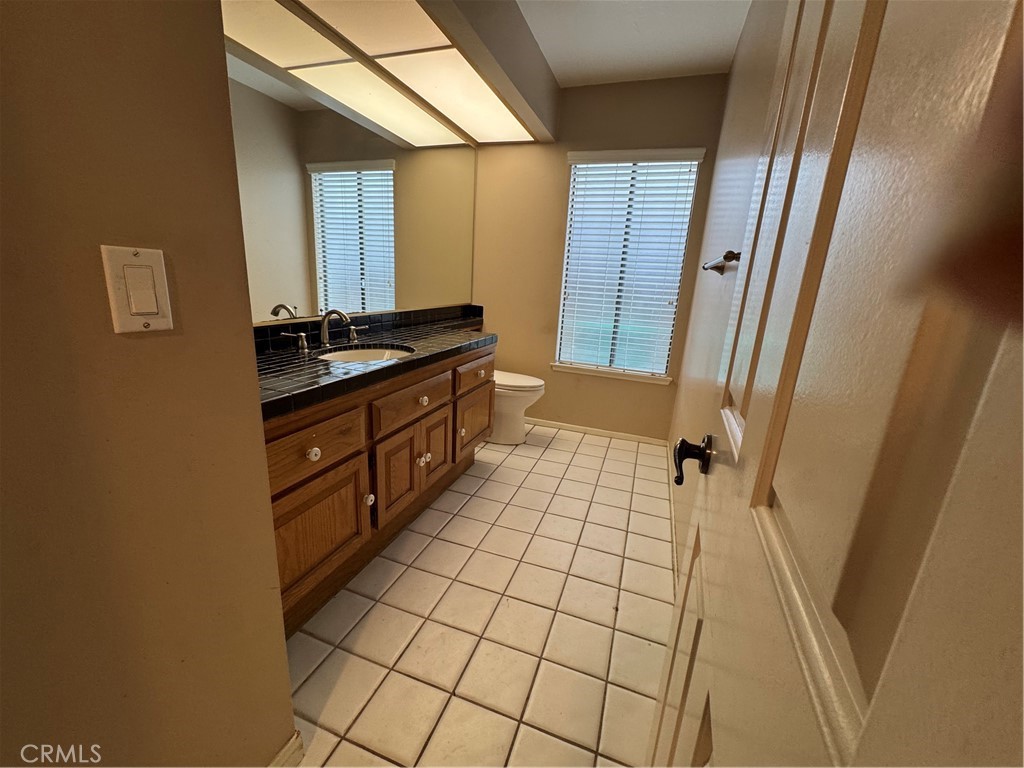 6 Recodo Irvine, CA 92620 - Photo 12 of 33 a bathroom with a sink a mirror and a shower