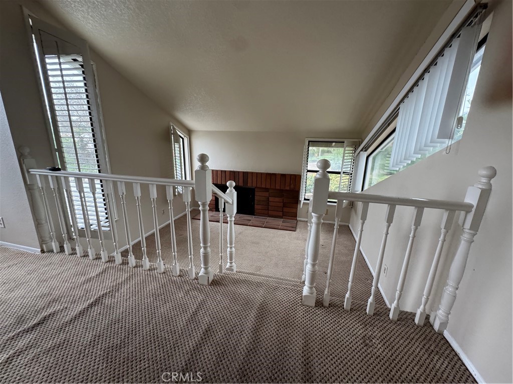 6 Recodo Irvine, CA 92620 - Photo 15 of 33 a view of staircase with lots of frames on wall and a window