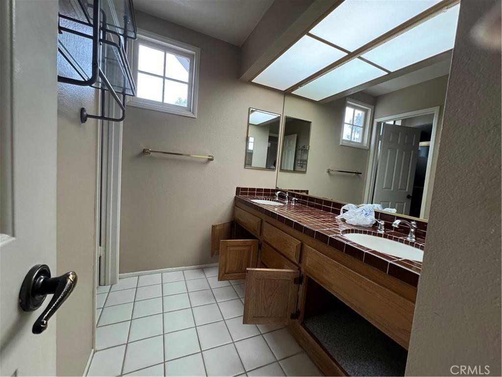 6 Recodo Irvine, CA 92620 - Photo 22 of 33 a room with a sink and a mirror