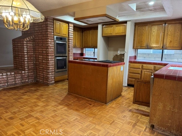 6 Recodo Irvine, CA 92620 - Photo 9 of 33 a kitchen with stainless steel appliances granite countertop a stove and a refrigerator
