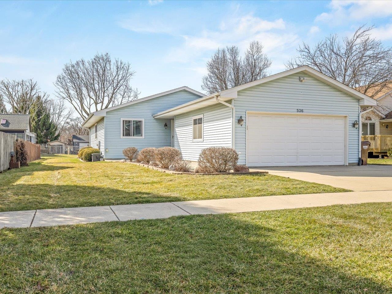 536 Carpenter Street Belvidere, IL 61008 - Photo 1 of 39 a house that has a big yard with large trees