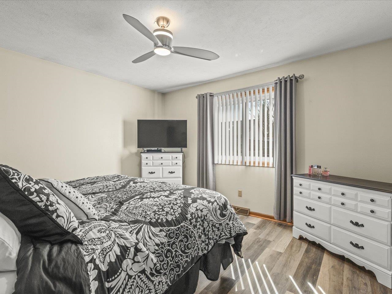 536 Carpenter Street Belvidere, IL 61008 - Photo 18 of 39 a bedroom with a bed and a tv