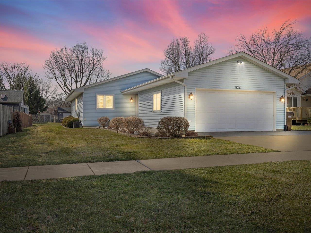 536 Carpenter Street Belvidere, IL 61008 - Photo 2 of 39 a front view of house with yard and trees
