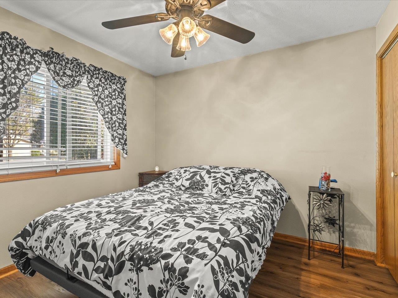 536 Carpenter Street Belvidere, IL 61008 - Photo 21 of 39 a bed sitting in a bedroom next to a window and a chandelier