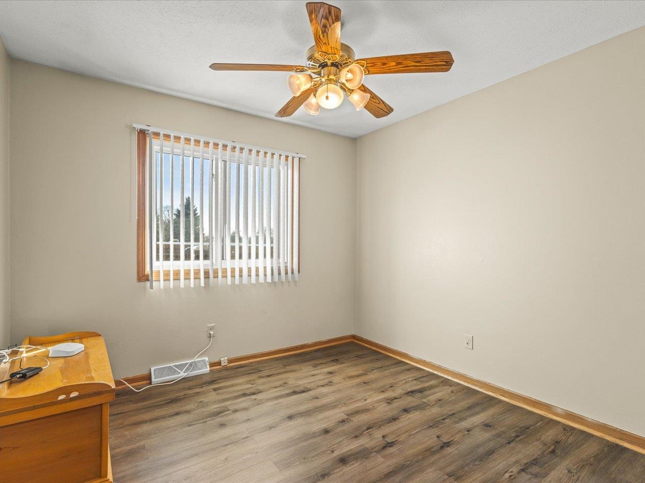 536 Carpenter Street Belvidere, IL 61008 - Photo 24 of 39 a view of a room with wooden floor and a window