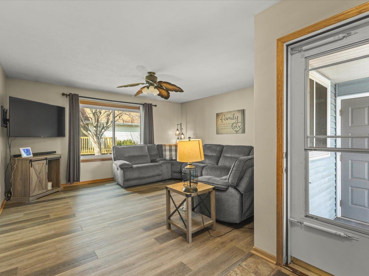 536 Carpenter Street Belvidere, IL 61008 - Photo 9 of 39 a living room with furniture and a flat screen tv