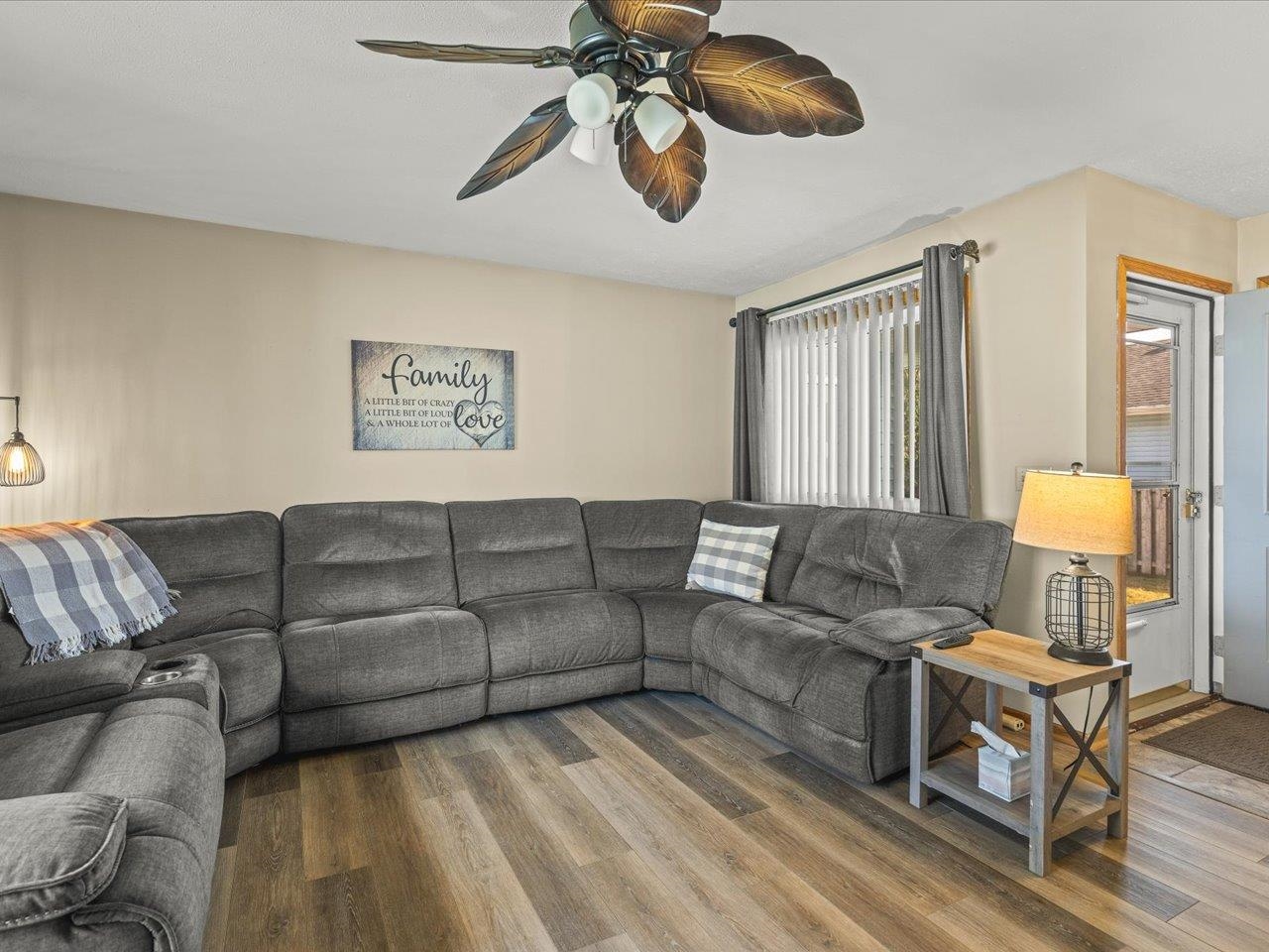 536 Carpenter Street Belvidere, IL 61008 - Photo 10 of 39 a living room with furniture a chandelier and a window