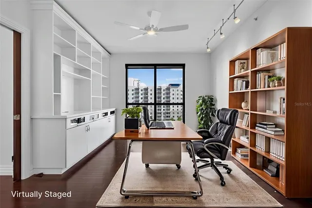 a bedroom with a large bed and a flat screen tv