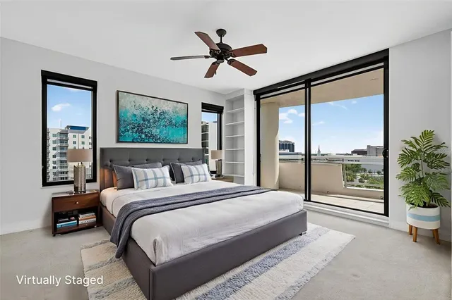 a bathroom with a granite countertop sink a toilet and bathtub