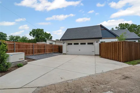 a front view of a house with a garage