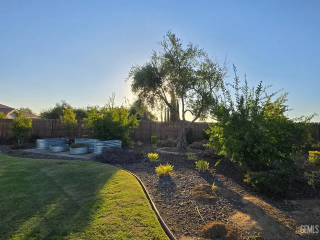 a view of swimming pool from a garden