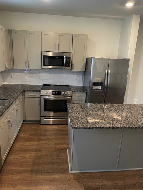 1741 Frodo Way Murfreesboro, TN 37128 - Photo 2 of 10 a kitchen with granite countertop a sink and steel appliances