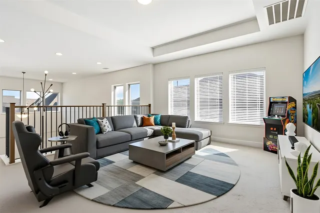 a room with furniture and a flat screen tv