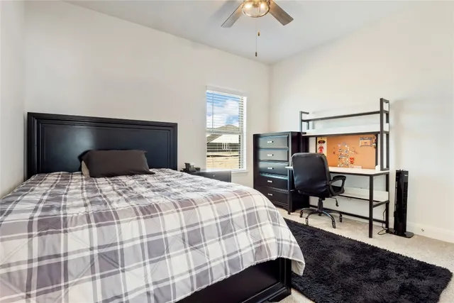 a bedroom with bed and window