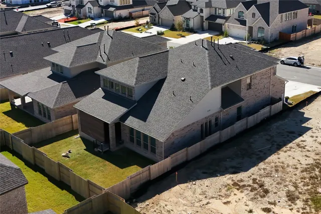 a view of a chairs and table in the back yard