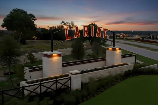 an aerial view of a resort with swimming pool and outdoor seating