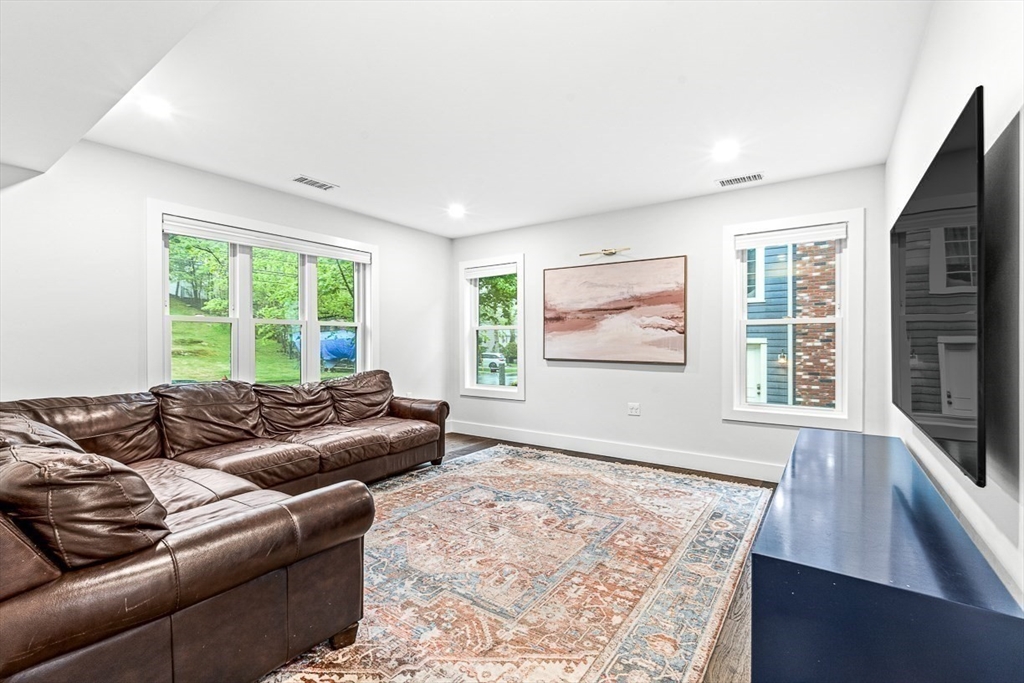 15 Rustic Road Stoneham, MA 02180 - Photo 20 of 42 a living room with furniture and a large window
