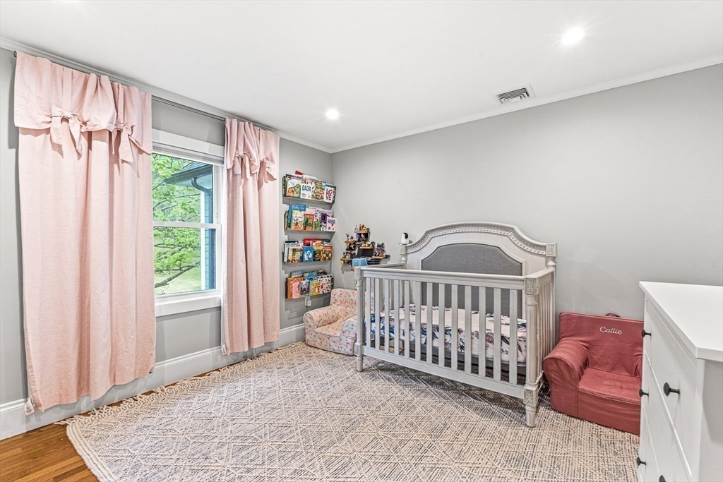 15 Rustic Road Stoneham, MA 02180 - Photo 24 of 42 a view of a bedroom with furniture and windows