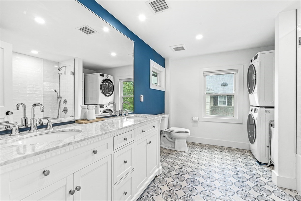 15 Rustic Road Stoneham, MA 02180 - Photo 26 of 42 a bathroom with a double vanity sink mirror and toilet
