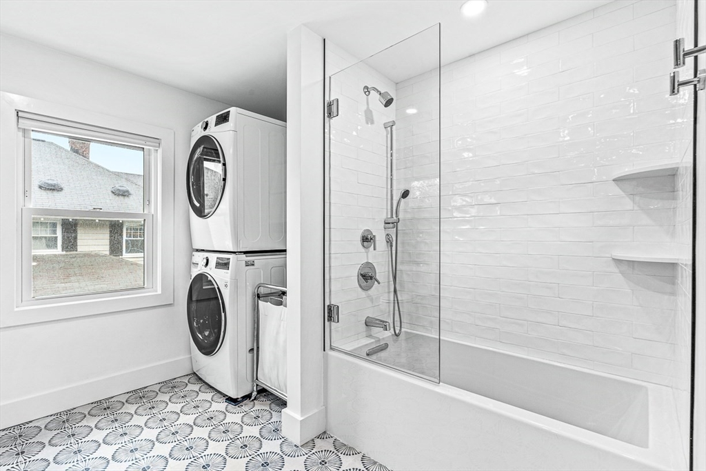 15 Rustic Road Stoneham, MA 02180 - Photo 27 of 42 a bathroom with a bathtub a window and a shower