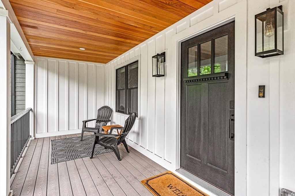 15 Rustic Road Stoneham, MA 02180 - Photo 3 of 42 a porch with seating space