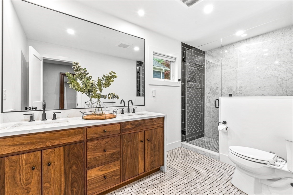 15 Rustic Road Stoneham, MA 02180 - Photo 33 of 42 a bathroom with a sink a toilet and shower