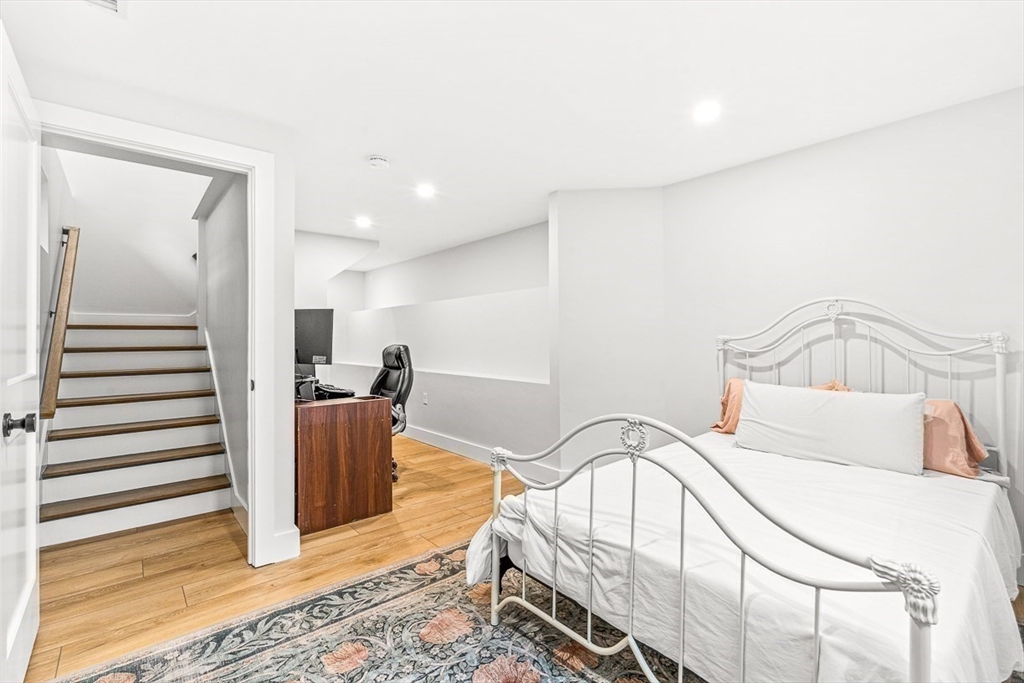 15 Rustic Road Stoneham, MA 02180 - Photo 37 of 42 a bedroom with a bed and a view of entryway