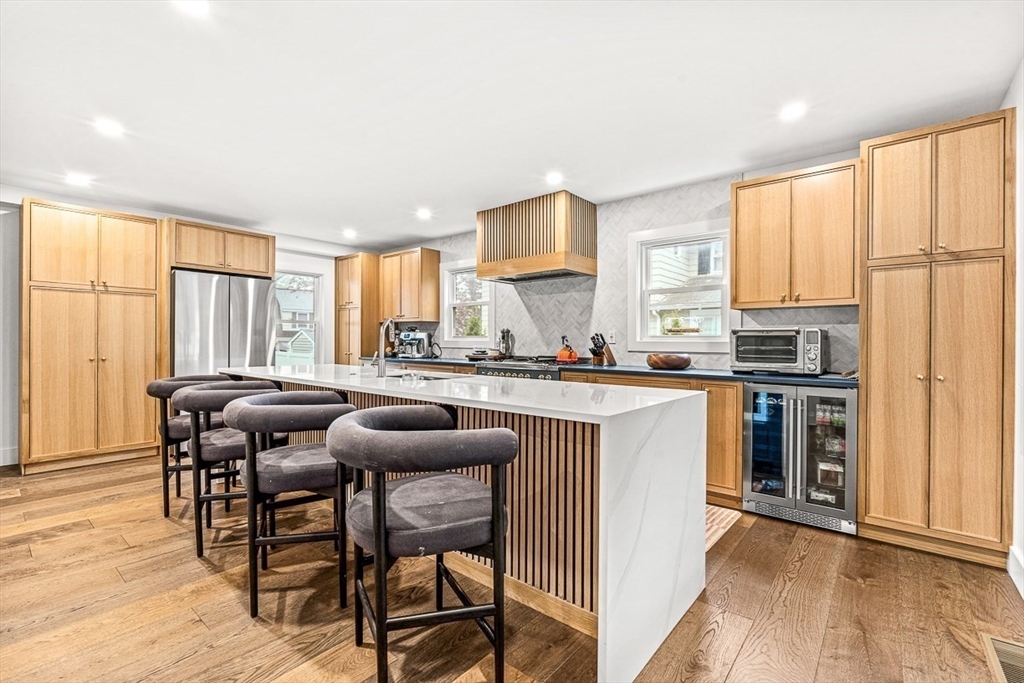 15 Rustic Road Stoneham, MA 02180 - Photo 4 of 42 a kitchen with stainless steel appliances granite countertop sink stove top oven and cabinets