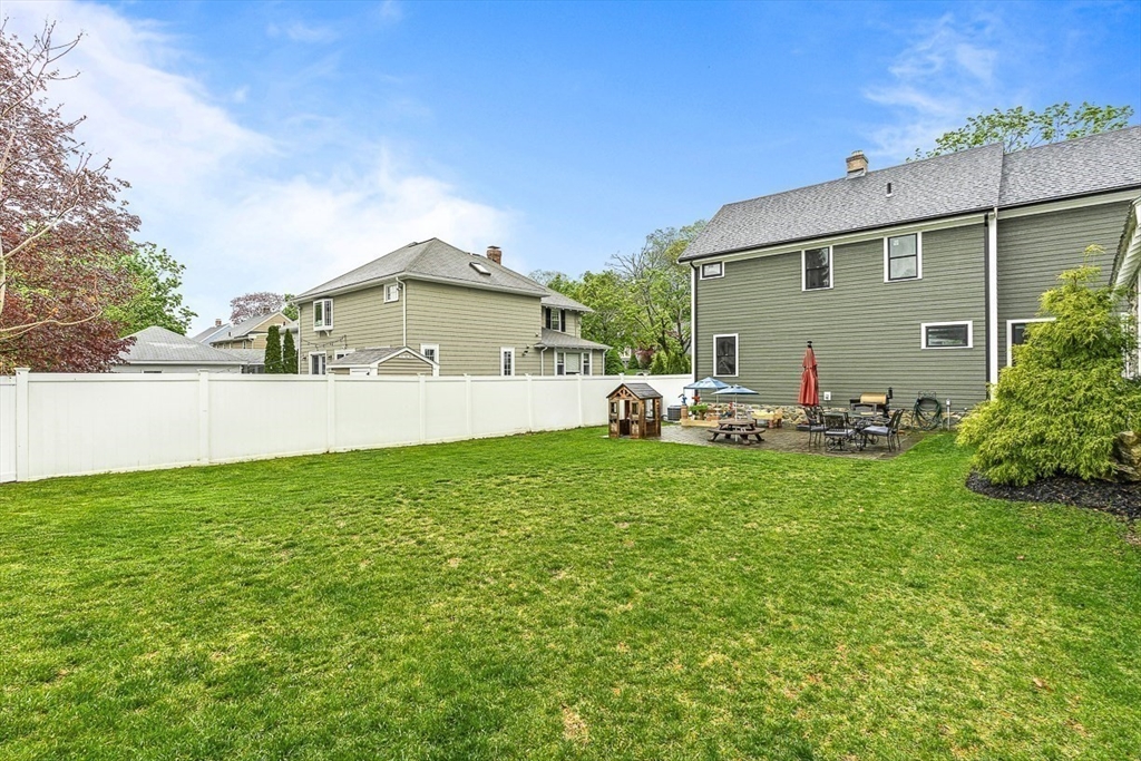 15 Rustic Road Stoneham, MA 02180 - Photo 41 of 42 a front view of a house with patio