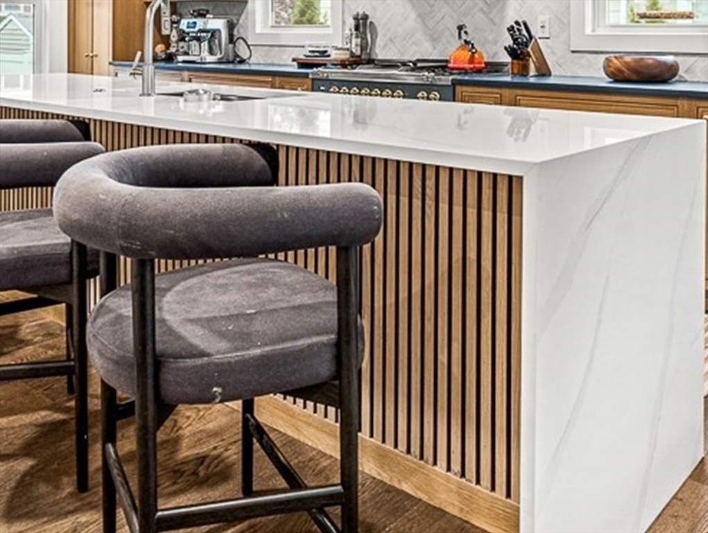 15 Rustic Road Stoneham, MA 02180 - Photo 10 of 42 a kitchen with a table and a chair