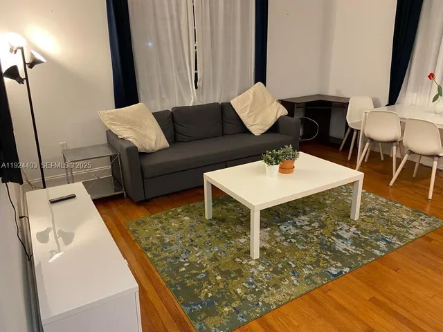 a living room with couch and a table
